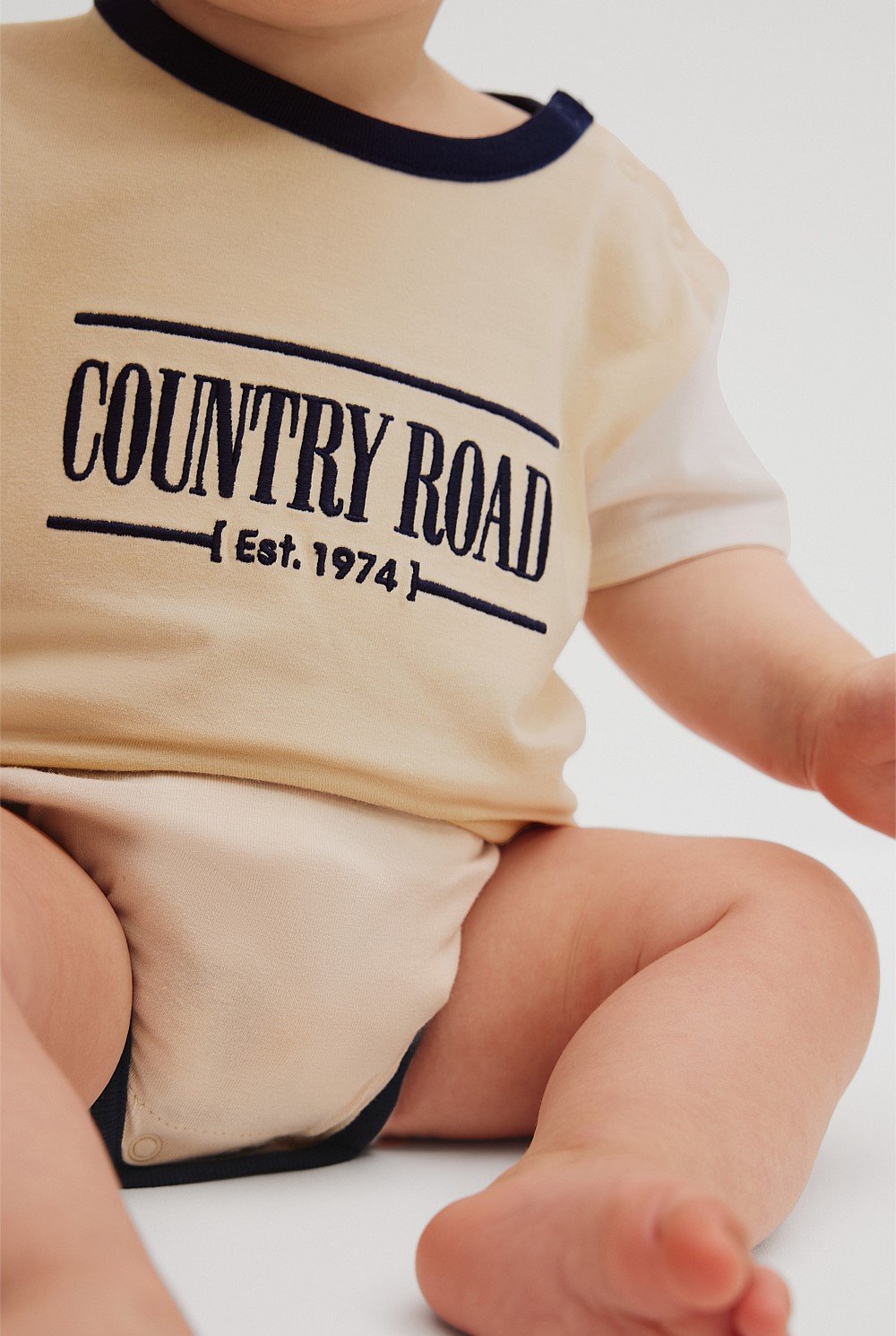 Organically Grown Cotton Spliced Logo Short Sleeve Bodysuit